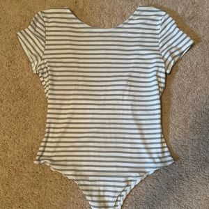 Striped body suit with an open back